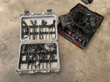 many wires in a case on the floor next to a laptop
