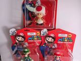 three action figures of mario and luigi from the nintendo super mario bros