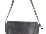 a black purse with a metal handle on a white background