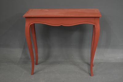 CONSOLE en bois peint en rouge reposant sur 4 pieds galbés