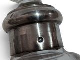 a close up of a metal object on a white background