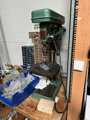 a machine that is sitting on top of a wooden table