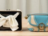 two purses that are sitting on a table
