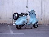 a scooter that is parked in a parking lot