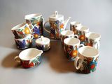 a group of cups and saucers sitting on a table