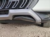 a close up view of a car ' s grille and bumper