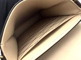 a purse that is open on a white surface