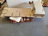 a pile of boxes on a pallet in a warehouse