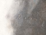 a close up of a metal plate with holes in it
