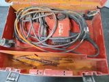 a red tool box with a bunch of wires in it
