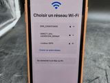 a close up of an iphone with a wifi button on the screen