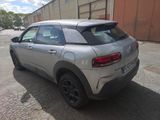 a silver car parked on the side of the road