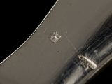 a close up of a knife on a black background