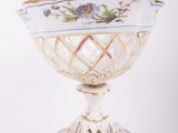 a white bowl with a blue and yellow design on it