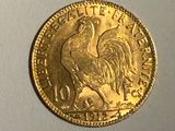 l'image d'une pièce d'or ornée d'un coq
