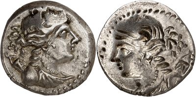 a silver coin with an image of a woman and a man on it