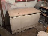 a dirty refrigerator in a dirty room with a window