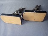 two birds that are sitting on a piece of wood