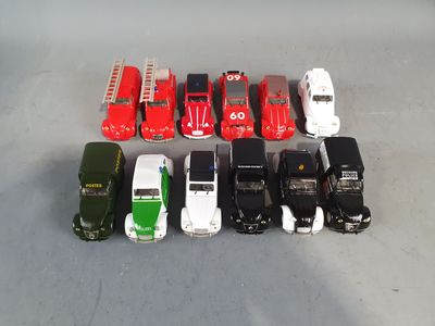 a lot of toy cars that are lined up on the floor