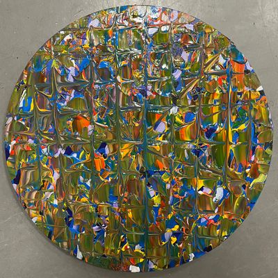 an image of a circular painting with a lot of paint on it
