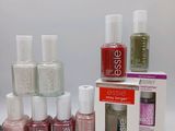 the bottles of nail polish are lined up on the table