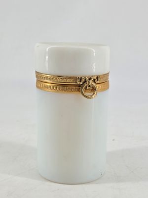 an image of a white jar with a gold band around it