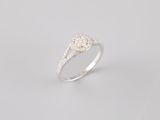 a close up of a diamond ring on a white background