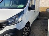 a white van parked next to a white car