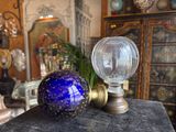 two glass balls sitting on top of a table