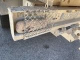 a truck that has a bunch of potatoes in the back of it