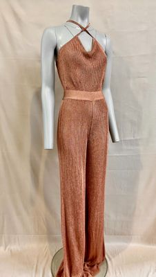 a mannequin wearing a pink jumpsuit with a halt