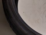a close up of a tire tire on a white surface