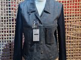 the mannequin is wearing a blue jacket and a black shirt