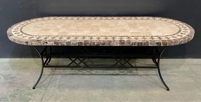a table that has a tile top on it