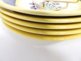 four plates stacked on top of each other on a table
