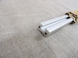 a metal rod that is laying on a cloth