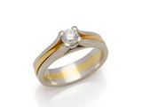 a gold and silver ring with a single diamond