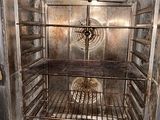 an open oven with a lot of food inside of it