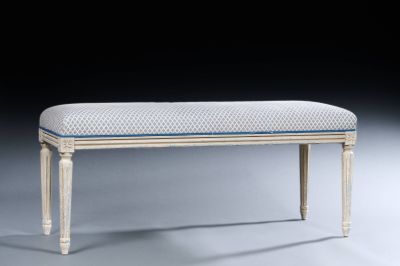 a white bench with a blue stripe on it