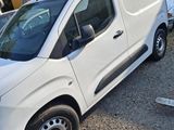 a picture of a white van parked in a parking lot