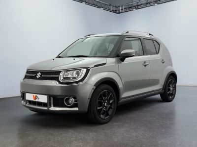 the suzuki ign is parked in a large room with a white wall
