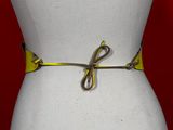 a close up of a mannequin torso with a yellow belt