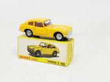 a yellow toy car sitting on top of a box