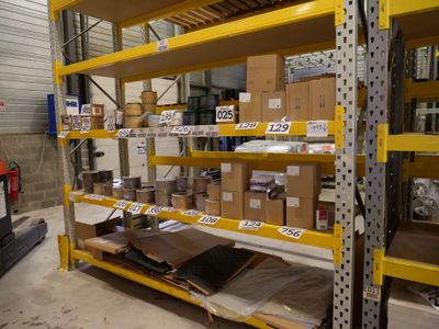many boxes on the shelves in the warehouse