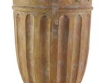 a vase that has a cross on the top of it
