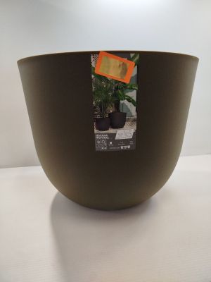 un bol marron posé sur une table, dans lequel se trouve l'image d'une plante