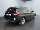 a picture of a black car parked in a garage