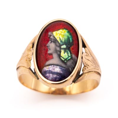 an image of a gold ring with a picture of a woman in a turban on it