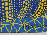 a picture of a blue and yellow painting on the wall