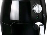 a close up of a black air fryer on a white background